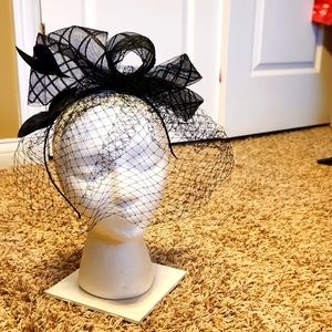 Black fascinator with facial netting.  New Without Tags.